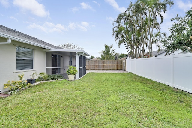 view of yard featuring a sunroom