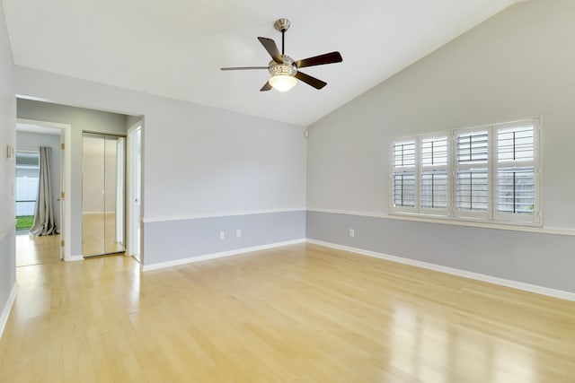 spare room featuring ceiling fan, vaulted ceiling, and light hardwood / wood-style flooring