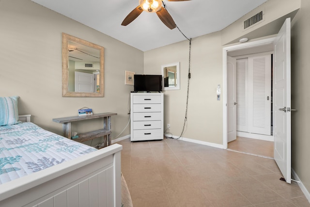 bedroom with ceiling fan and light tile patterned flooring