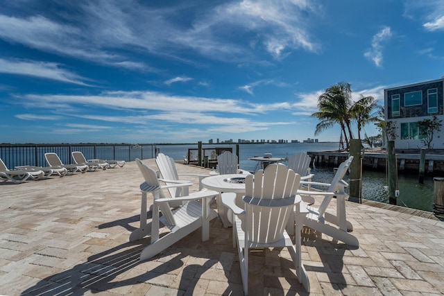 exterior space featuring a water view and a dock