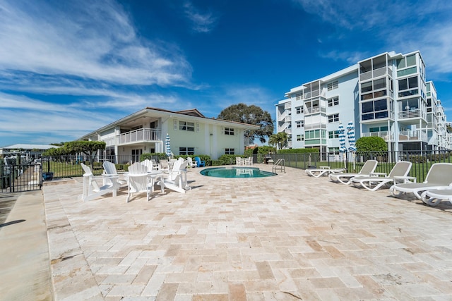 view of swimming pool featuring a patio area