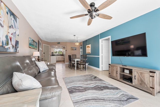 tiled living room featuring ceiling fan