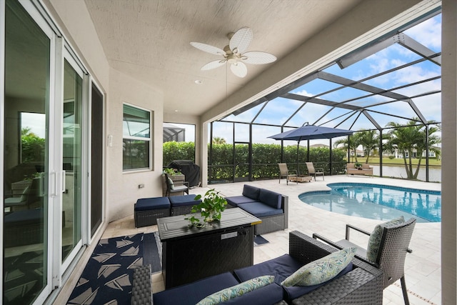 view of pool with grilling area, glass enclosure, a patio area, an outdoor living space, and a water view