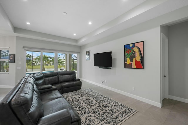 living room with a tray ceiling