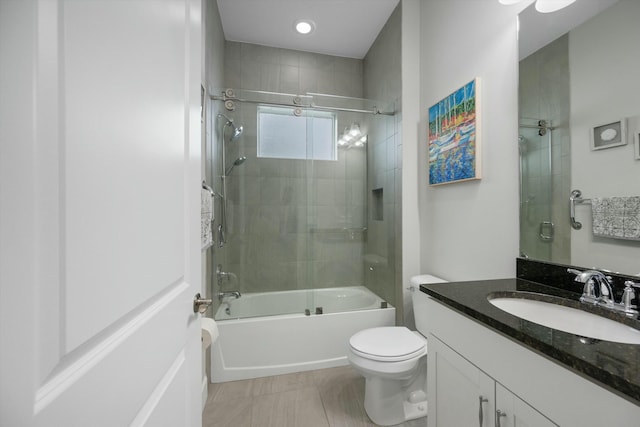 full bathroom with toilet, enclosed tub / shower combo, tile patterned flooring, and vanity