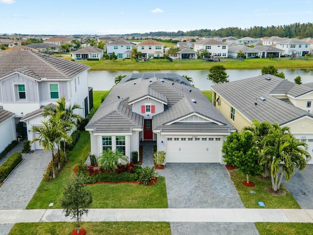 birds eye view of property featuring a water view