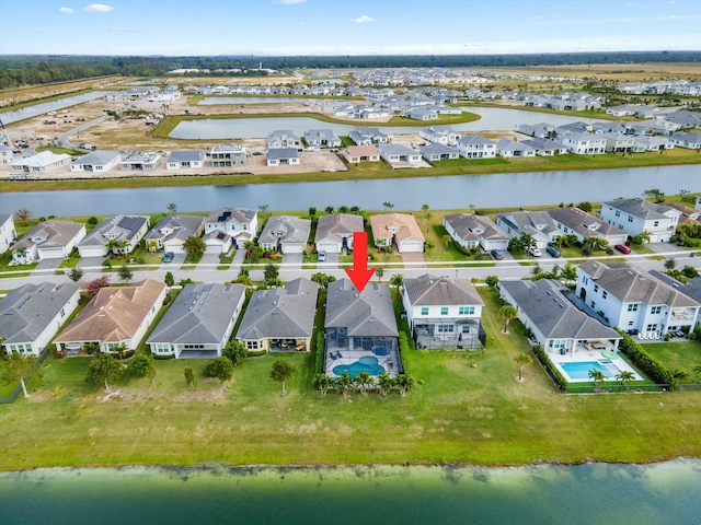 drone / aerial view with a water view