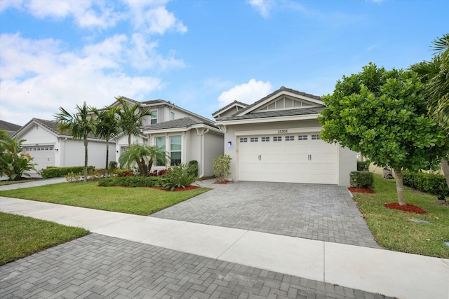 view of front of house featuring a garage and a front yard