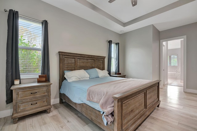 bedroom with baseboards, ceiling fan, and light wood-style floors