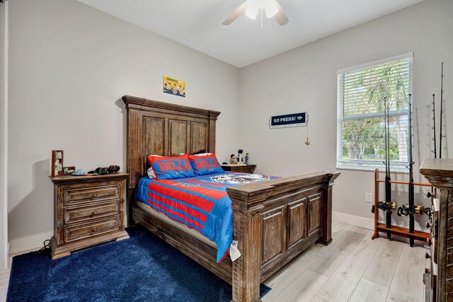 bedroom with a closet and light hardwood / wood-style floors