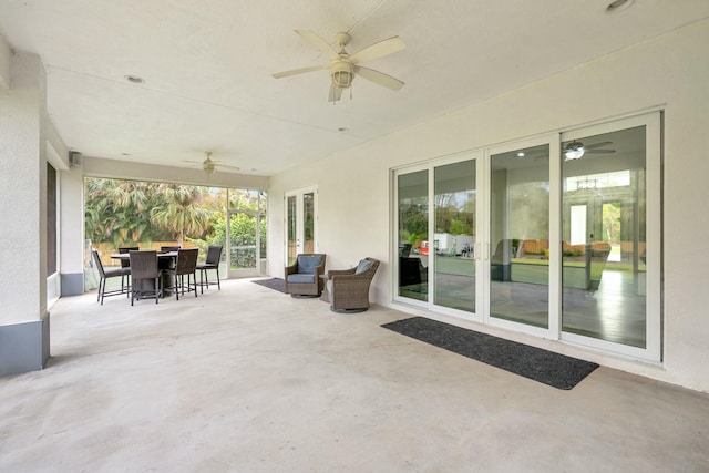 view of patio featuring outdoor dining space and a ceiling fan