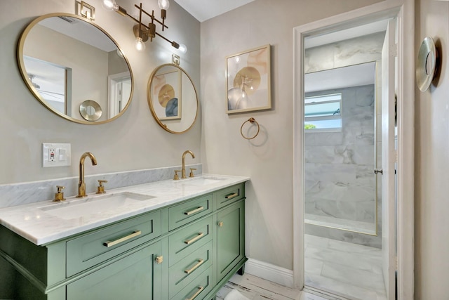 bathroom with tiled shower and vanity