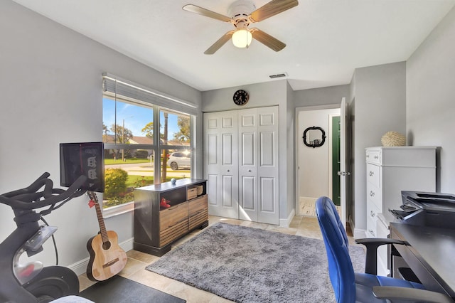 tiled office with a wealth of natural light and ceiling fan