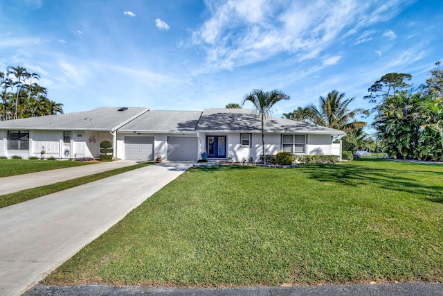 ranch-style house with a front yard and a garage