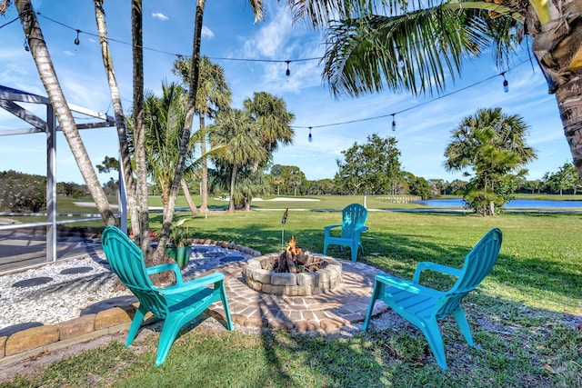 view of patio featuring a water view and an outdoor fire pit