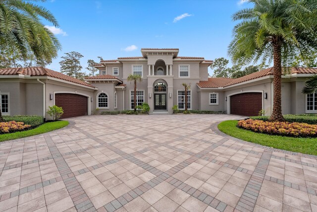 rear view of house with ceiling fan, a swimming pool with hot tub, and a patio area