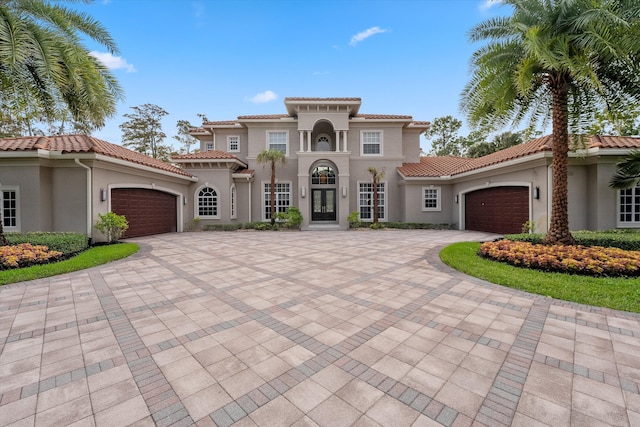 mediterranean / spanish house featuring a garage