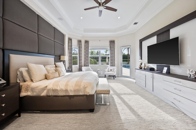 bedroom with ceiling fan, a raised ceiling, access to exterior, light colored carpet, and ornamental molding