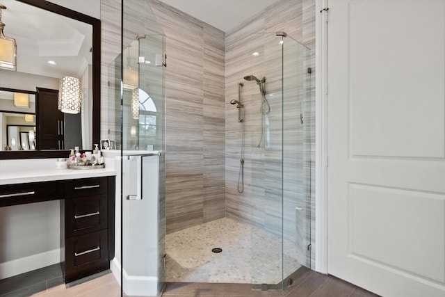 bathroom featuring tile patterned floors, walk in shower, and vanity