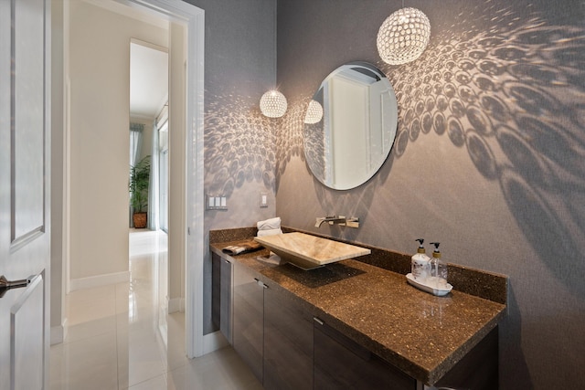 bathroom with tile patterned floors and vanity