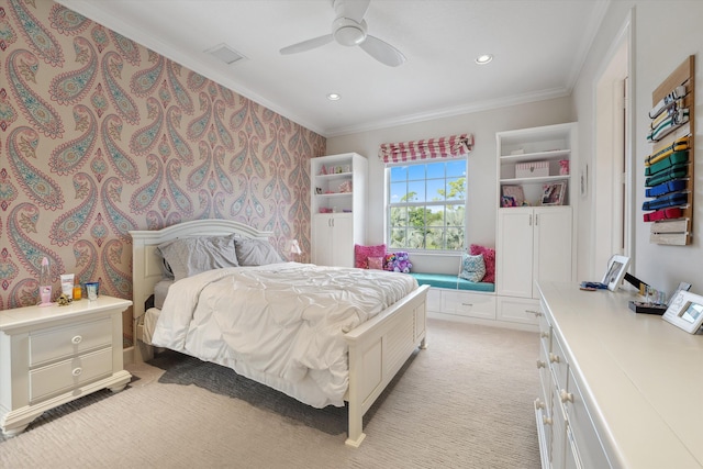 carpeted bedroom with ceiling fan and crown molding