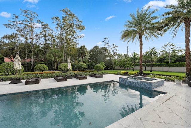 view of swimming pool with an in ground hot tub and a patio