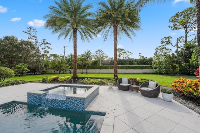 view of swimming pool with an in ground hot tub, a yard, and a patio