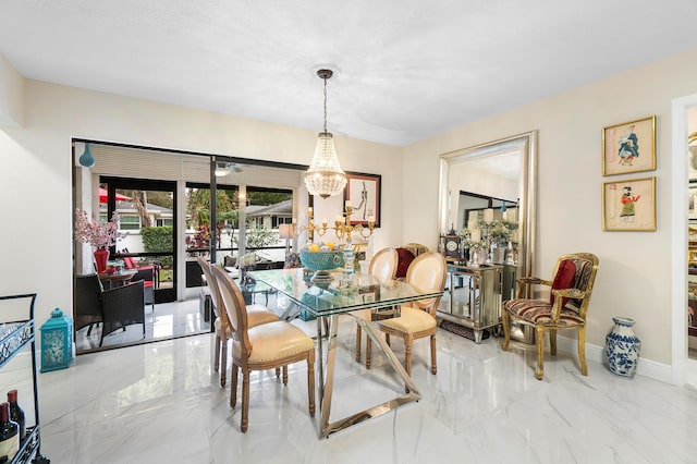 dining space featuring an inviting chandelier