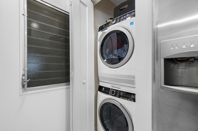 washroom with stacked washer / dryer