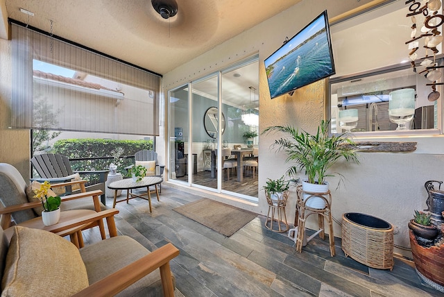 sunroom / solarium with ceiling fan