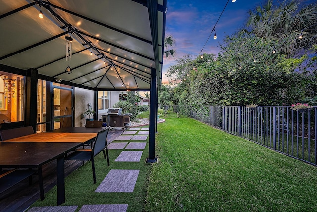 yard at dusk with a patio area and a gazebo