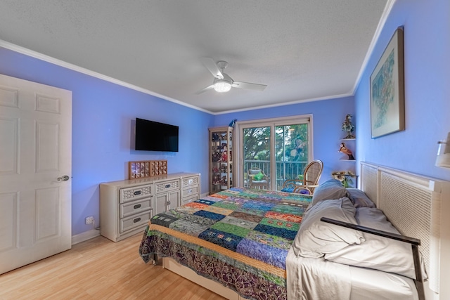 bedroom featuring ceiling fan, a textured ceiling, ornamental molding, and light wood-type flooring