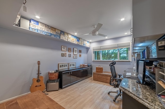 office area with ceiling fan and light hardwood / wood-style flooring