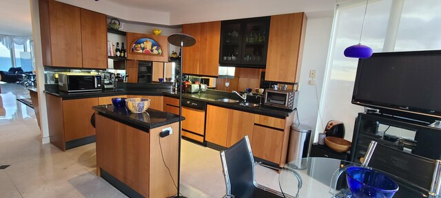 kitchen featuring sink and black appliances