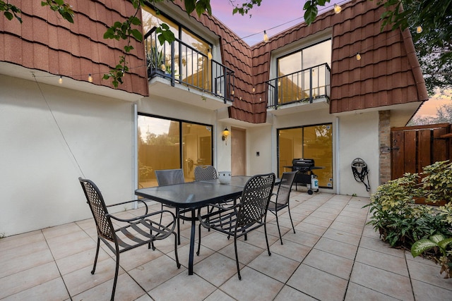 patio terrace at dusk with a balcony