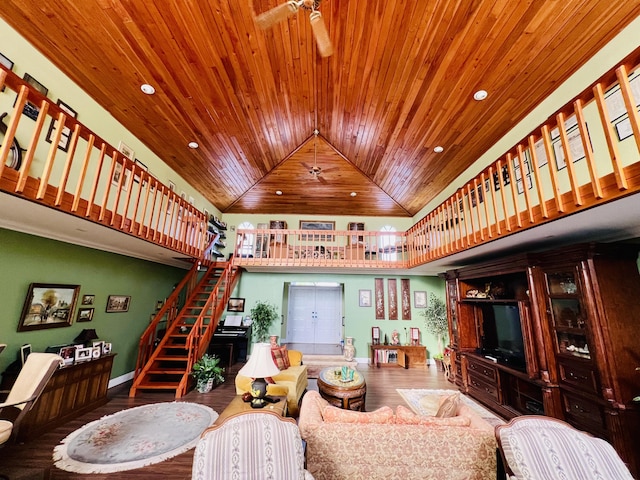 living room with ceiling fan, wood ceiling, hardwood / wood-style floors, and high vaulted ceiling