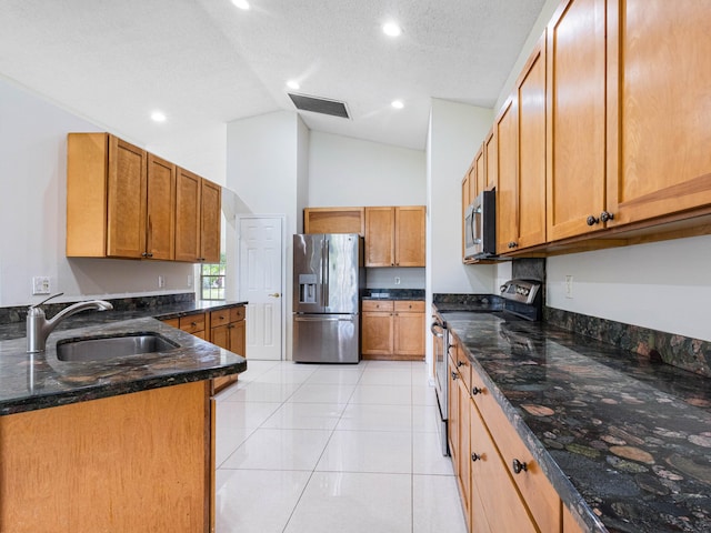 1784 Sawgrass Cir, Greenacres, FL 33413 - kitchen featuring appliances with stainless steel finishes, a sink, dark stone countertops, high vaulted ceiling, and light tile patterned flooring