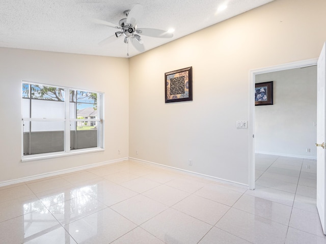 1784 Sawgrass Cir, Greenacres, FL 33413 - empty room with light tile patterned floors, ceiling fan, baseboards, recessed lighting, and a textured ceiling