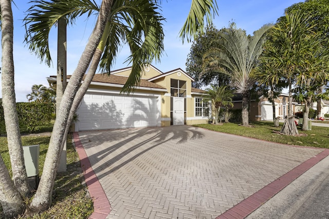 view of front of property with a garage