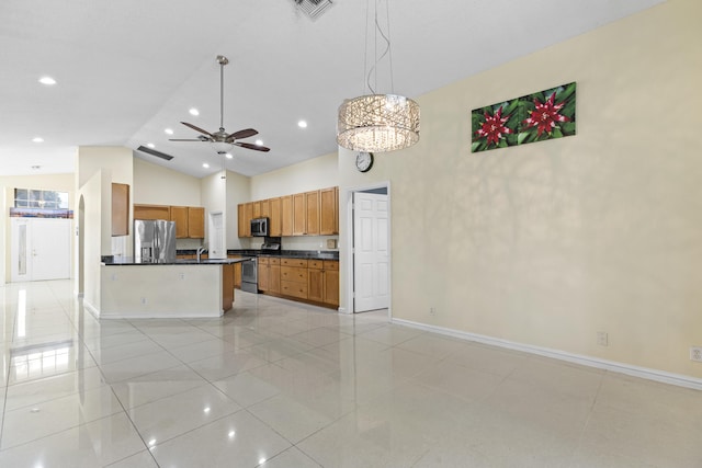 kitchen with ceiling fan, appliances with stainless steel finishes, decorative light fixtures, light tile patterned floors, and high vaulted ceiling