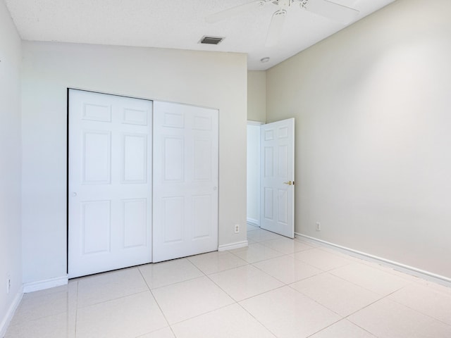1784 Sawgrass Cir, Greenacres, FL 33413 - unfurnished bedroom featuring baseboards, a closet, light tile patterned flooring, and a ceiling fan