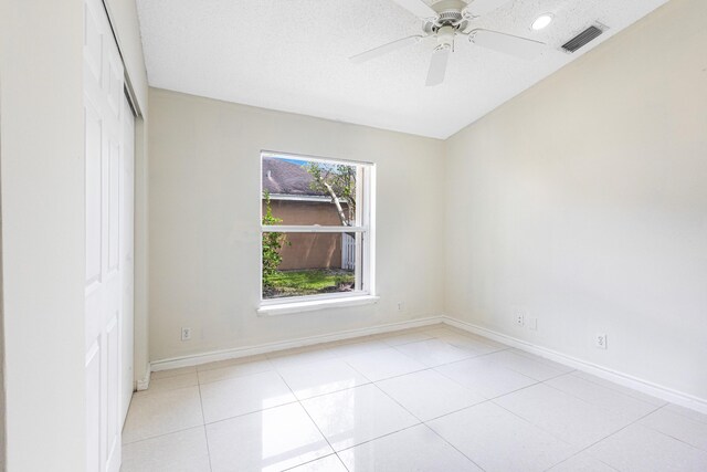 1784 Sawgrass Cir, Greenacres, FL 33413 - unfurnished bedroom featuring a closet, baseboards, light tile patterned floors, ceiling fan, and recessed lighting