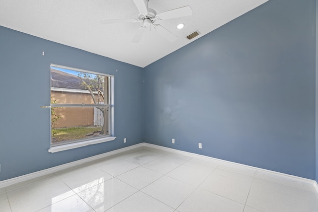 empty room featuring light tile patterned floors and ceiling fan