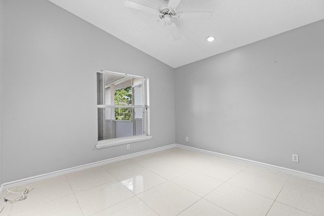 unfurnished room featuring light tile patterned floors, vaulted ceiling, and ceiling fan