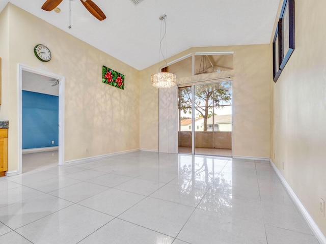 1784 Sawgrass Cir, Greenacres, FL 33413 - spare room with ceiling fan, baseboards, light tile patterned flooring, and vaulted ceiling