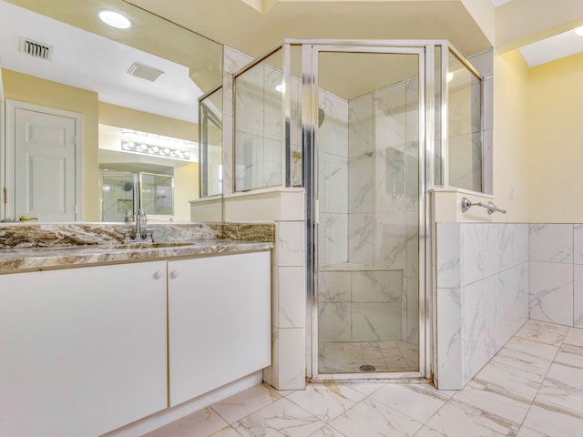 1784 Sawgrass Cir, Greenacres, FL 33413 - full bath featuring marble look tile flooring, a shower stall, vanity, and recessed lighting