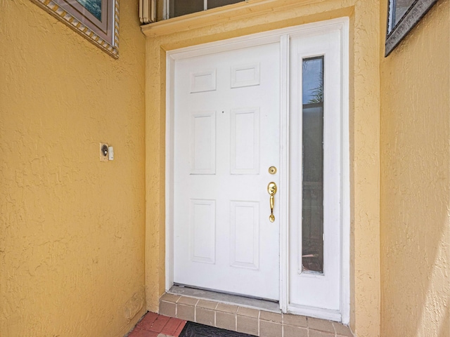 1784 Sawgrass Cir, Greenacres, FL 33413 - doorway to property featuring stucco siding