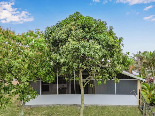 1784 Sawgrass Cir, Greenacres, FL 33413 - back of house with a sunroom