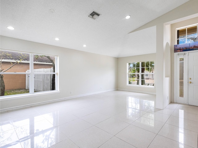 1784 Sawgrass Cir, Greenacres, FL 33413 - tiled spare room featuring recessed lighting, a textured ceiling, and lofted ceiling