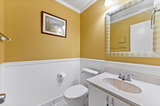 bathroom featuring toilet, vanity, crown molding, and tile patterned flooring